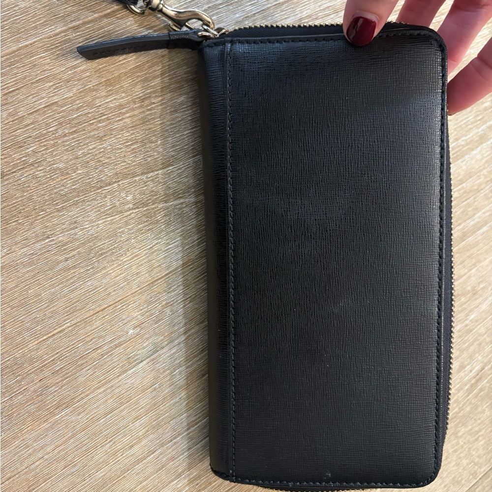 Brand new Dooney & Bourke wallet/wristlet Black with navy/cream interior